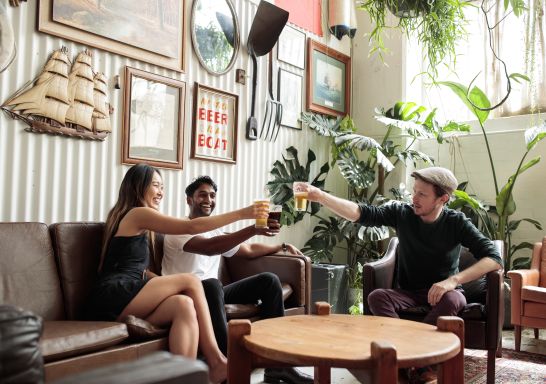 Friends enjoying beers at Willie The Boatman in St. Peters, Inner Sydney