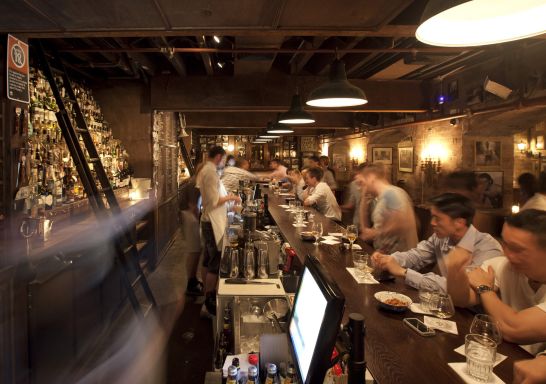 People sitting at the bar at The Baxter Inn, Sydney CBD