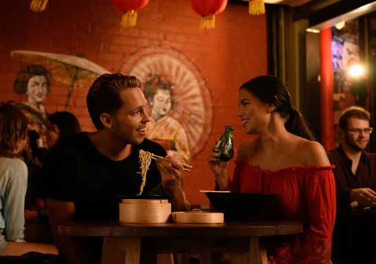 Couple enjoying food and drink at Spice Alley - Chippendale