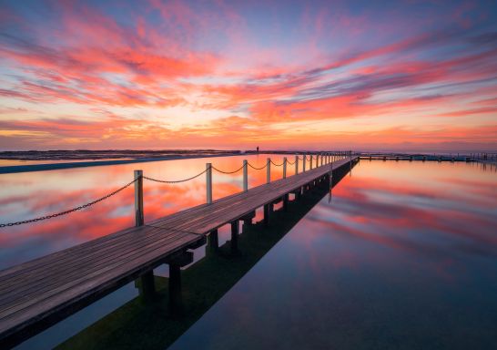 Sun rising over North Narrabeen Rockpool, Narrabeen