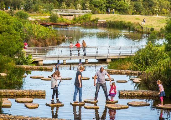 Family enjoying the picturesque wetlands at Sydney Park, St Peters